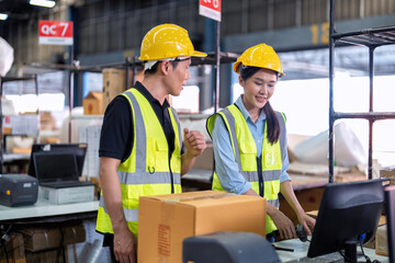 Staff working in large depot storage warehouse trainee check packing box and scan at cashier counter