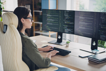 Photo of smart busy lady it professional wear spectacles coding new application indoors workplace...