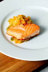 Grilled salmon dish with chopped vegetables