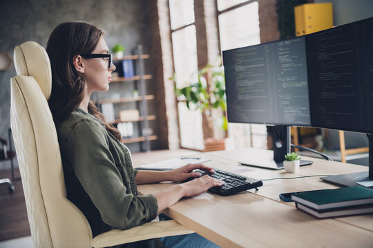 Photo of intelligent clever lady programmer wear glasses writing code modern device indoors workstation workshop
