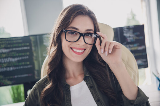 Photo of happy adorable lady professional wear spectacles creating new start up indoors workplace workshop