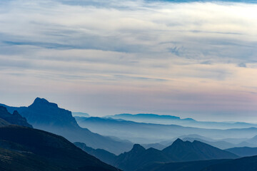 Foggy landscape with the Pyrenees mountains (Spain) in the background during sunrise.