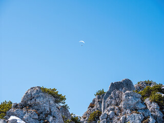 Let me glide along the Bavarian alp rocks during sunshine and blue sky