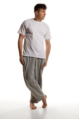 Mature man posing in shirt and pants over white studio background. Comfortable homewear. Casual look. Relaxed. Men's health and beauty