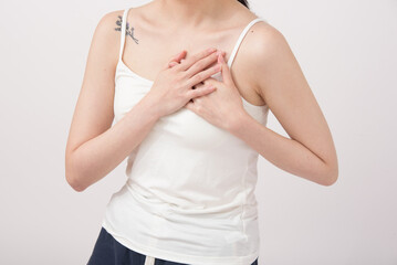 adult woman feels sick, while standing and suffering from unbearable pain.