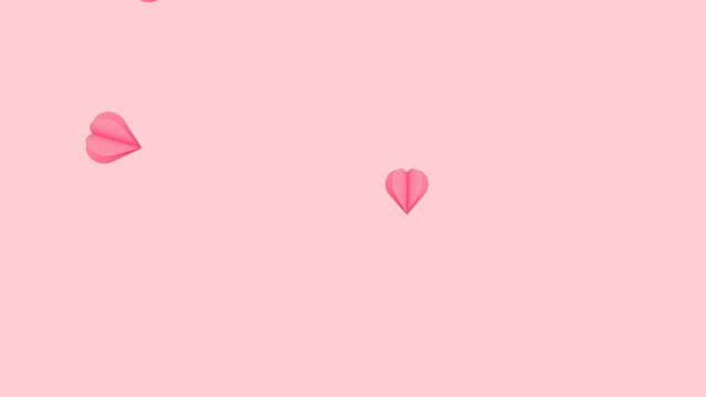 Origami heart background. Simple floating origami heart footage on pink background. 4K UltraHD motion graphic animation.