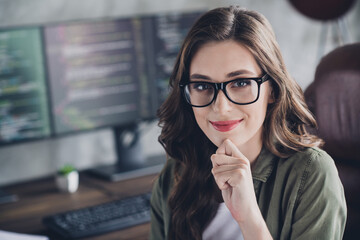 Photo of creative smart minded person sit chair hand touch chin create script open space office indoors