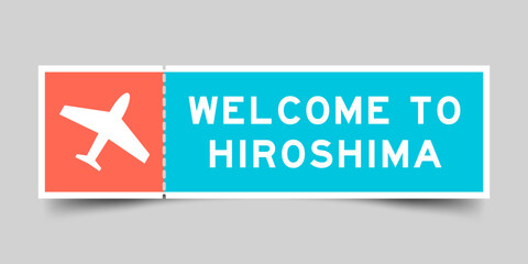 Orange and blue color ticket with plane icon and word welcome to hiroshima on gray background
