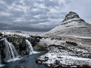 Snow covered mountains and waterfall