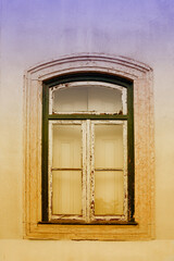 one arched window with peeled off paint, old house