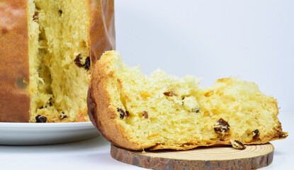 Panettone, typical Italian sweet, presented on a light background