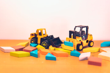 Mini forklift truck with tangram puzzle using as logic and transportation concept