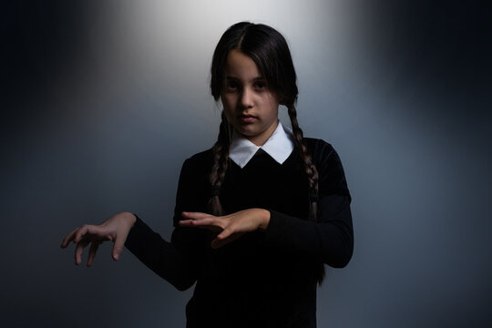 a girl Wednesday Addams. Halloween party