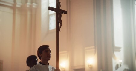 Liturgy In Church: Procession Of Ministers, Bearing Holy Cross From Altar, As Congregation Looks In Wonder. Christians Rejoice In Celebration Of Divine Mass. Sacred Place Filled With Joy. Slow Motion