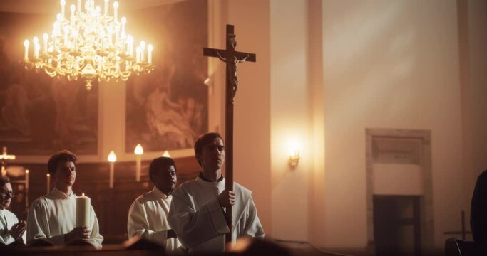 Liturgy In Church: Procession Of Ministers, Bearing Holy Cross from Altar, As Congregation Stands In Wonder. Christians Rejoice In Celebration Of Divine Mass. Hymns Praise God. Slow Motion Portrait