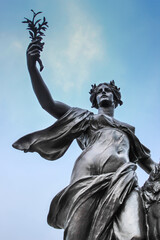 Women statue, holding a branch London
