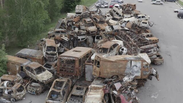 Junkyard of burnt cars. Consequences of a full-scale invasion of Russian troops on the territory of Ukraine. Bucha, Irpin 2022
