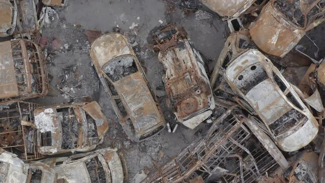 Junkyard of burnt cars. Consequences of a full-scale invasion of Russian troops on the territory of Ukraine. Bucha, Irpin 2022