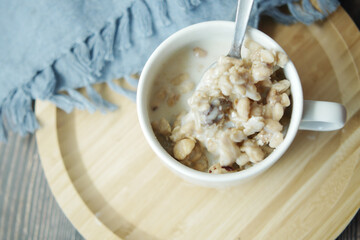 top view of granola Musli and milk in a cup on table 