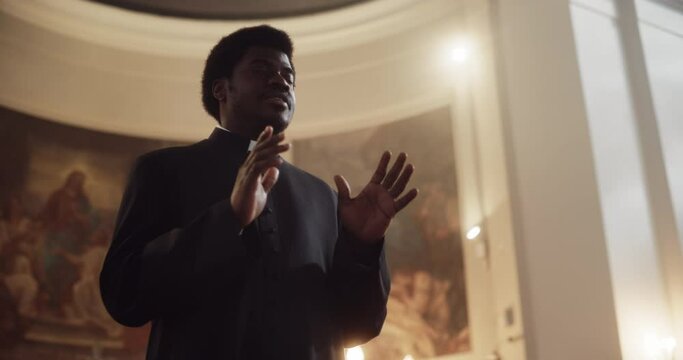 Service In Christian Church: Minister Leads Congregation In Prayer, Quotes The Bible, Gospel and Teaching of Jesus Christ. Priest Doing Sermon that Gives Hope. Beautiful Moment in Sacred Place