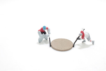 the Ice Hokey Player push the coins