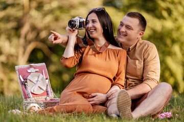 Pregnant couple in nature
