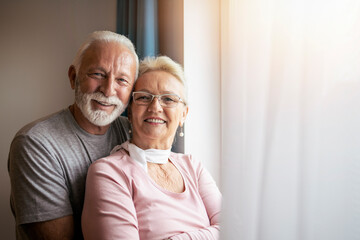 Happy senior couple enjoying time at home