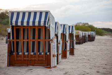 closed down beach chairs on a sandy beach at the baltic sea, germany 