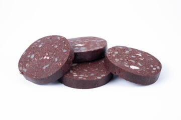 Thick slices of pork farmhouse black pudding isolated on a white background