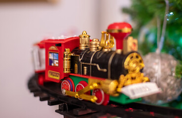 Christmas tree, a detail of the decoration. Santa's train, lights and colours.