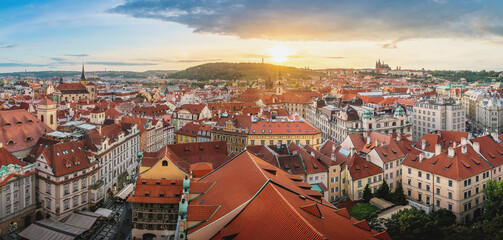 Panoramic aerial view of Stare Mesto at sunset with Prague Castle and Petrin Hill on background - Prague, Czech Republic