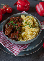 Hungarian goulash with pasta on a plate