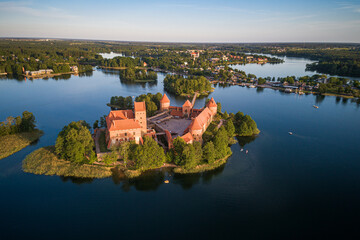 Obraz premium Trakai Castle with lake and forest in background. One of the most famous Sightseeing place in Lithuania. Galve lake and Island.