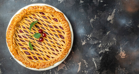 Delicious Homemade Cherry Pie, Flaky Crust, piece on a plate and the whole homemade cherry pie, Long banner format. top view