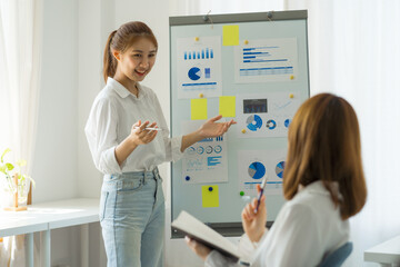 Fototapeta premium Friends of asia female employee worker discussing and accountant checking data document for investigation of corruption account. Anti Bribery concept, great business conversations