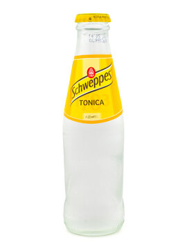 ROME, ITALY - DECEMBER 29, 2022. Classic glass bottle of Schweppes Tonic isolated on white background. Schweppes is a Swiss beverage brand that is sold around the world. 