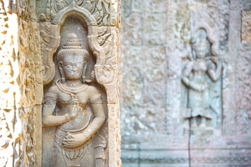 Khmer apsara sculture on the wall at Preah Khan temple