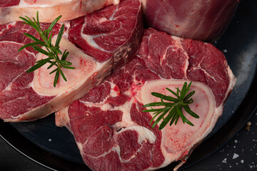 Raw meat, steak on black background