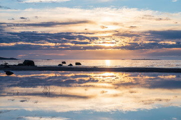 Sunset over the sea. Reflections in the water. Storsand, Nykarleby/Uusikaarlepyy. Finland