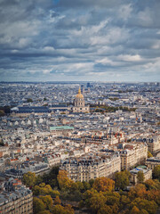 Aerial view of Paris cityscape, France. Les Invalides building with golden dome. Autumn parisian scene, vertical background