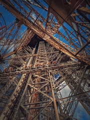 Eiffel Tower architecture details Paris, France. Underneath the metallic structure, steel elements...