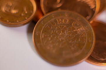 A pile of change on the table. Many euro coins in one stack. The concept of a monetary crisis in the country. Selective soft focus
