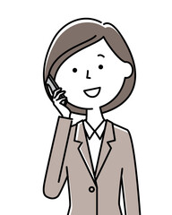 電話するスーツの女性
