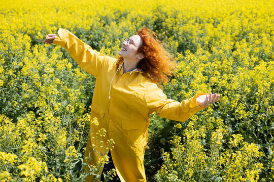 A woman enjoying warmth of the sun on a sunny spring day