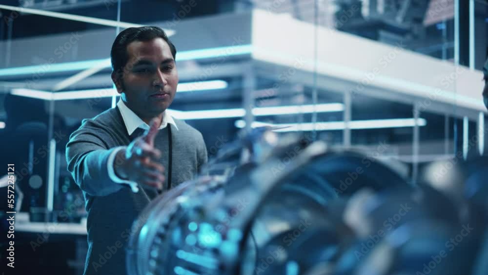 Aufkleber Handsome Multiethnic Chief Engineer Explaining the Technology Behind a Modern Turbofan Aircraft Engine to Team of Colleagues in the Aerospace Research and Development Industry.
