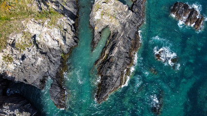 Turquoise waters of the Atlantic Ocean and large coastal cliffs. Beautiful seascape, top view....