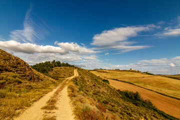 road n the mountains with clouds