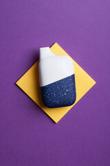 disposable electronic cigarette or vape on purple background. top view copy space. nicotine vapor...