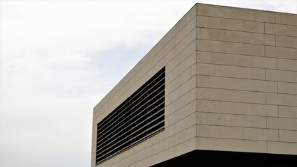 Fototapeta na wymiar contemporary building facade against sky