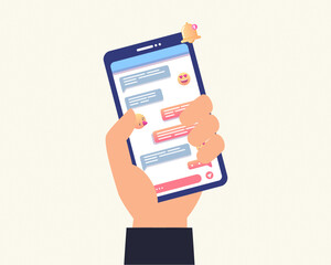 Hands holding smartphone or mobile phone with chat or messenger application on screen. Instant message notification.